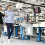 EthonAI co-founders Julian Senoner (CEO, right) and Bernhard Kratzwald (CTO, left) at a Siemens factory in Zug, Switzerland