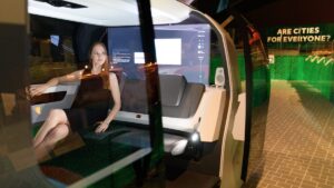 A gallery assistant sits inside the "Sedric" Volkswagen driverless concept car during the press launch of the exhibition; "The Future Starts Here" at Victoria and Albert Museum on May 9, 2018 in London, England.
