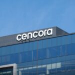 a photo of cencora's logo at the top of its headquarters in PA